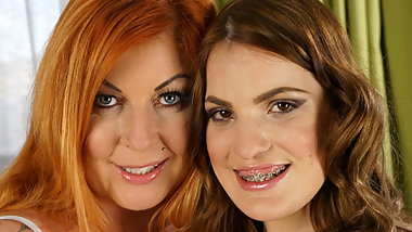 Mature inked babe and her younger lesbian friend