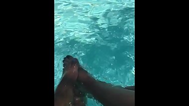 teen girl feet splashing in water